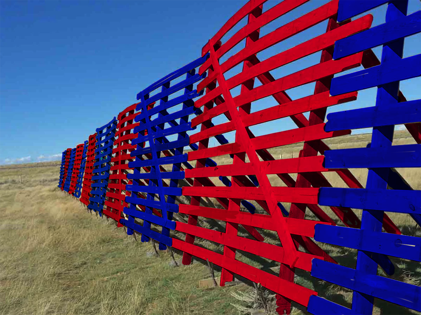 snow fence with panels painted alternating blue and red vaguely suggesting democrats and republicans of american political parties and in a landscape of high plains dry grass